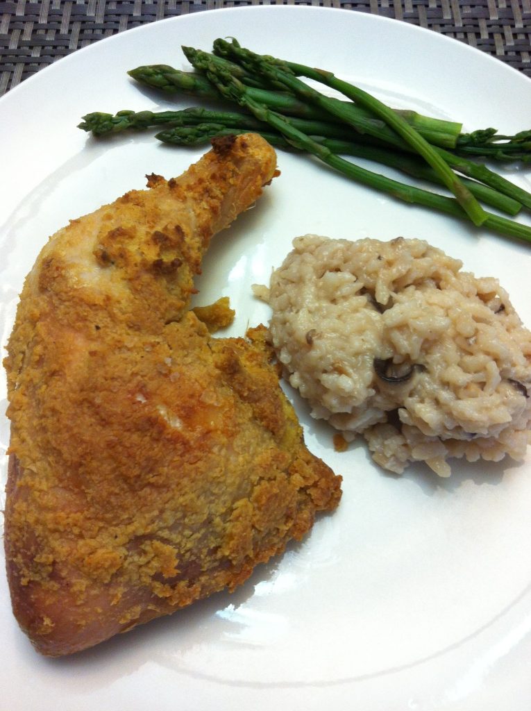 gluten free oven roasted hummus (humus) crust chicken Hummus (humus) crusted chicken baked in the oven along side risotto and asparagus