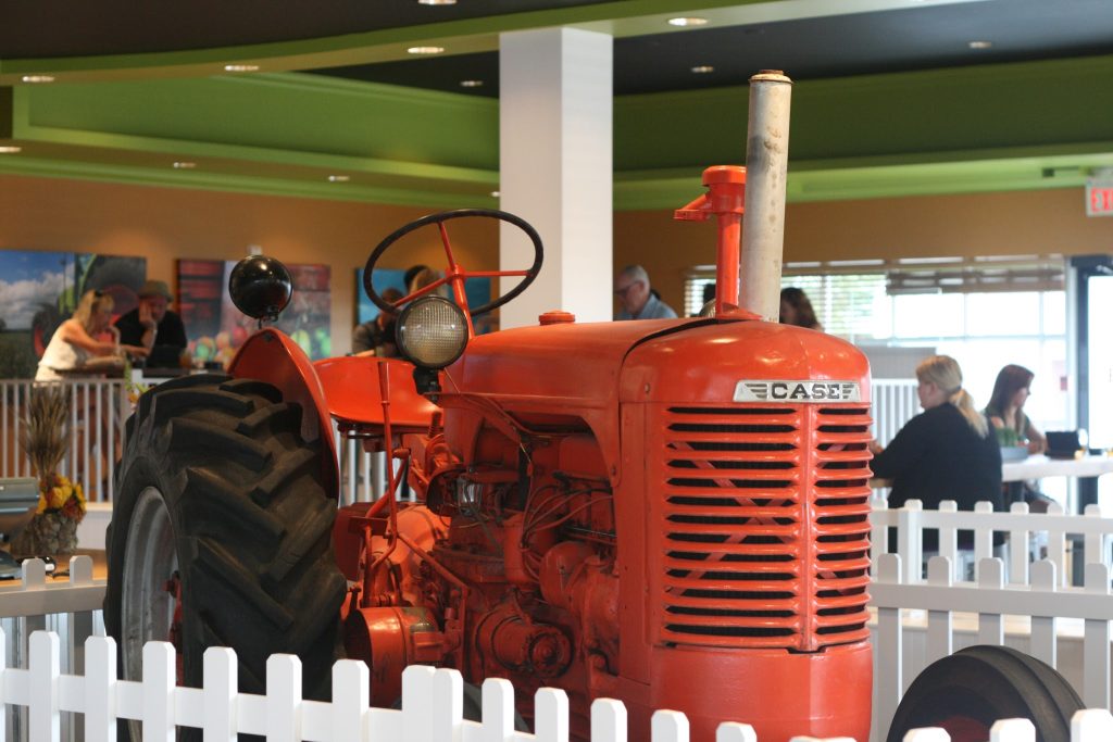 Big red tractor at the front door of P&H.