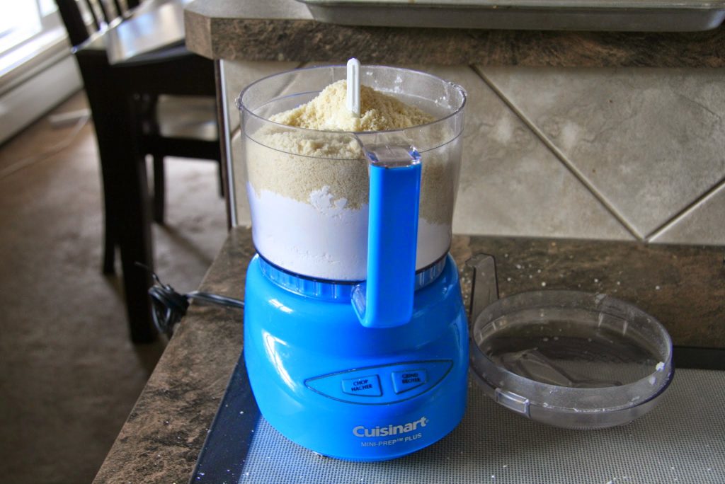 Almond meal and powdered sugar in food processor.