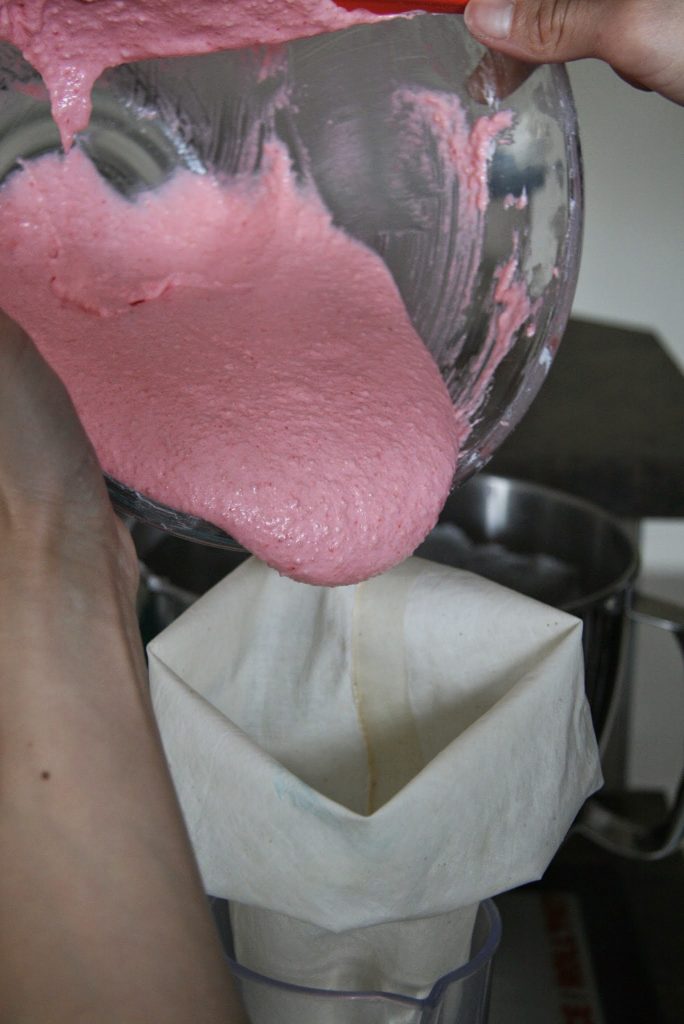 Transferring batter to piping bag. 