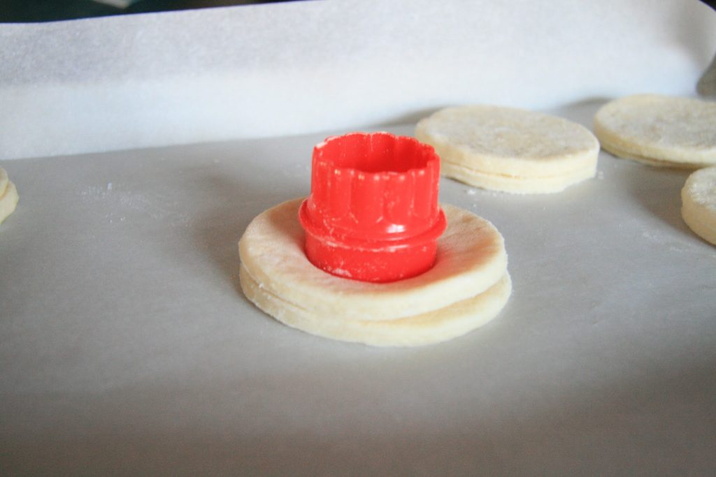Use a Cookie Cutter to cut cronut hole in NQN cronut. Use Cookie Cutter to cut cronut hole in Not Quite Nigella's cronut.