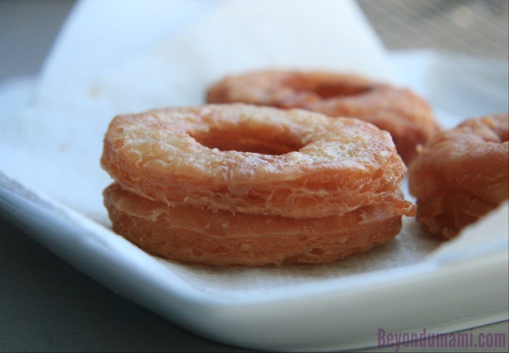 Close-up of Not-Quite-Nigella's Cronut. Close-up of Not-Quite-Nigella's Cronut. Showing the double-stacked doughs resulting in a thicker, flakier crust.