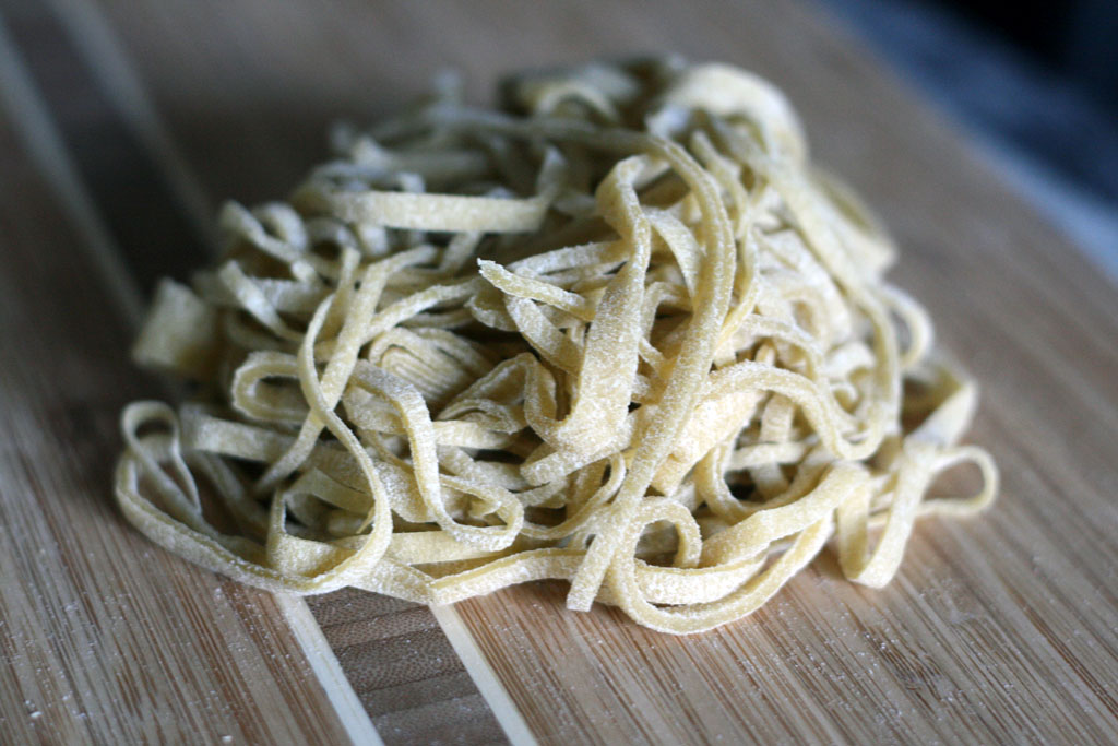 A pile of hand cut ramen noodle dough.