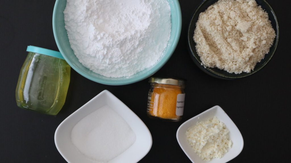 Ingredients for making lemon macarons - icing sugar, almond meal, albumen, berry sugar/extra fine sugar, egg whites and yellow powder