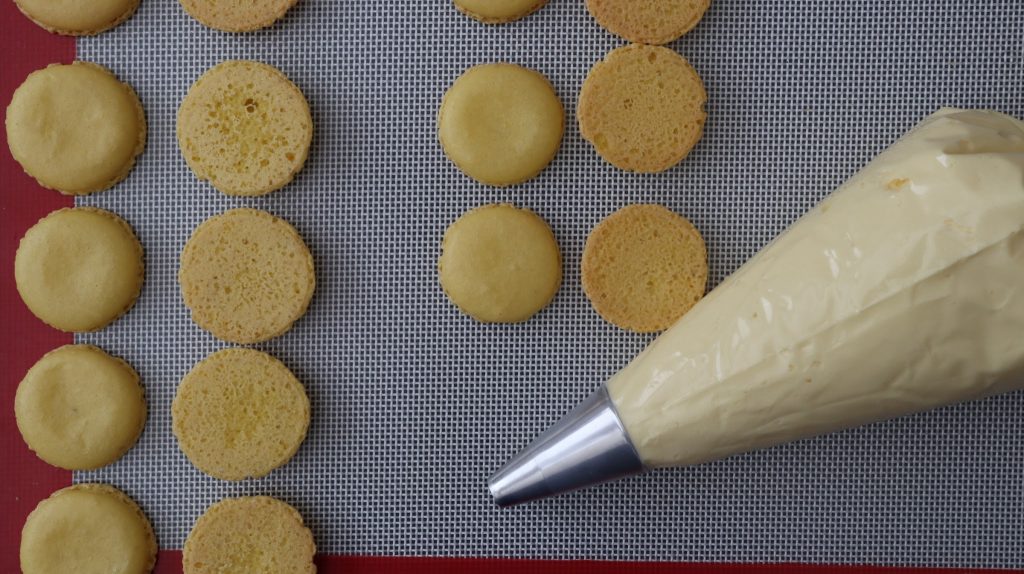 lemon macaron shells ready to be piped