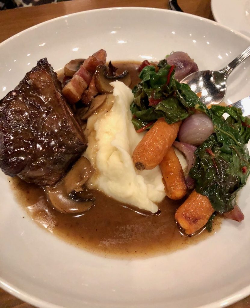 Braised Short Rib Bourguignon - with roasted carrots, mushrooms, lardons, potato puree & wilted greens at the Marc Edmonton